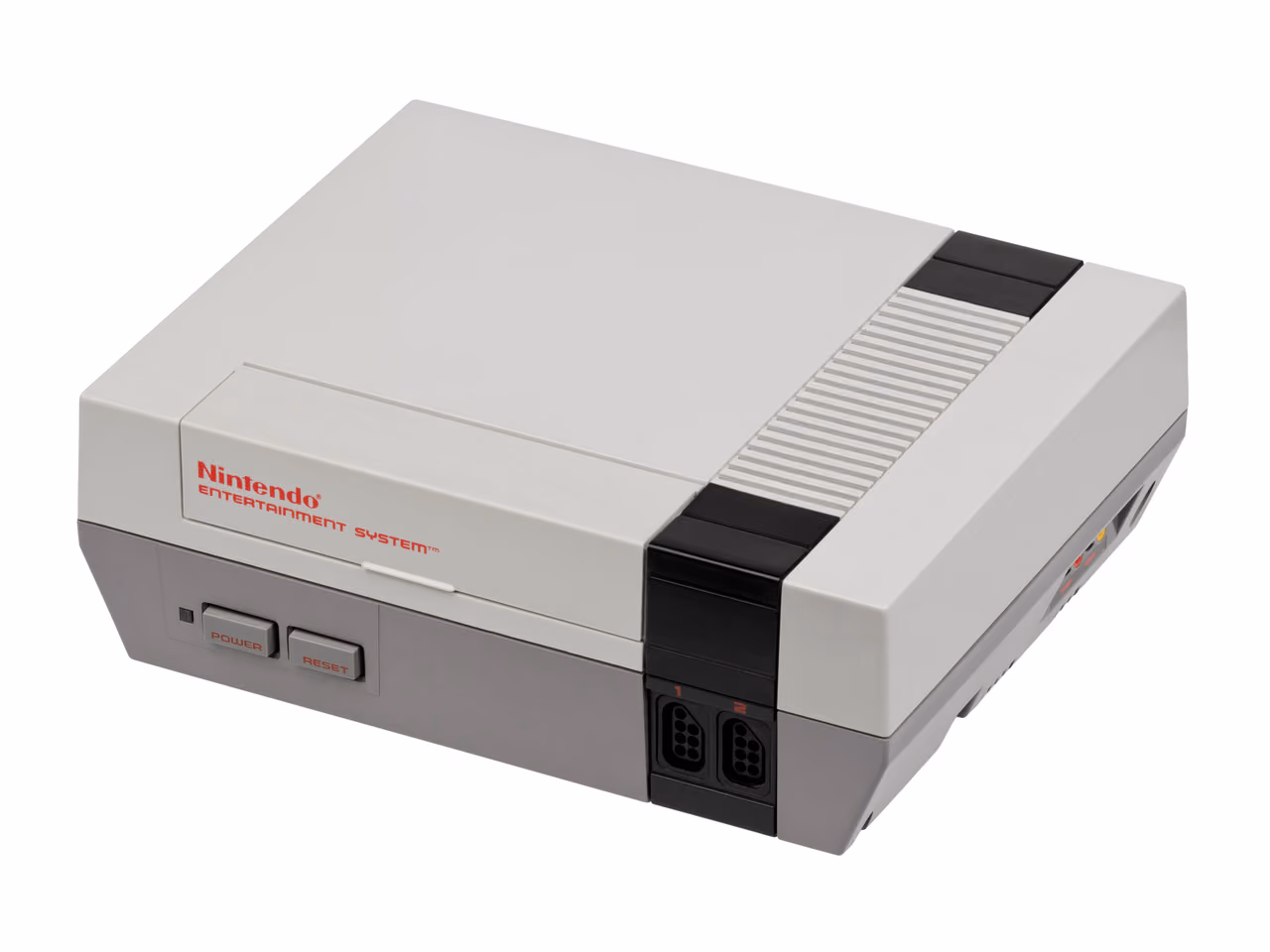 A gray and off-white Nintendo Entertainment System photographed against white from the front left, its front-loading cartridge door closed above the power and reset buttons and two controller ports.