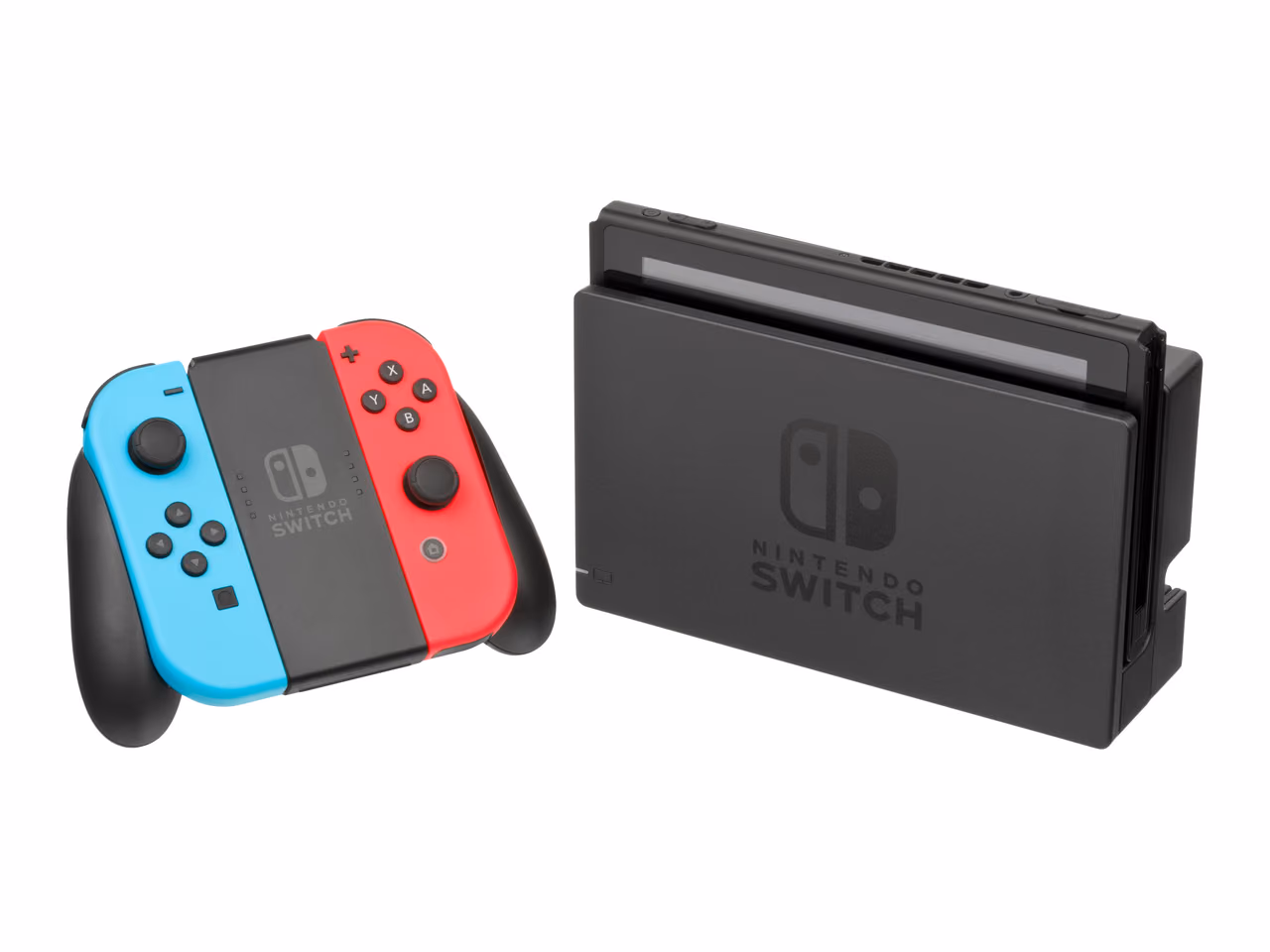 A Nintendo Switch seated in its black dock and photographed against white, with a pair of blue and red Joy-Con controllers clipped into a black grip standing to the left.