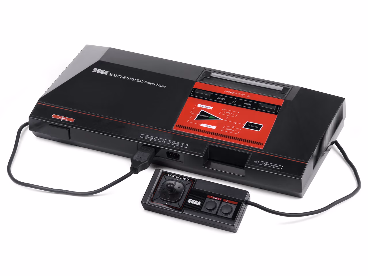 A black Sega Master System photographed against white from the front left, a cartridge slot and a card slot on its upper deck, with the control pad and its cable lying in front.