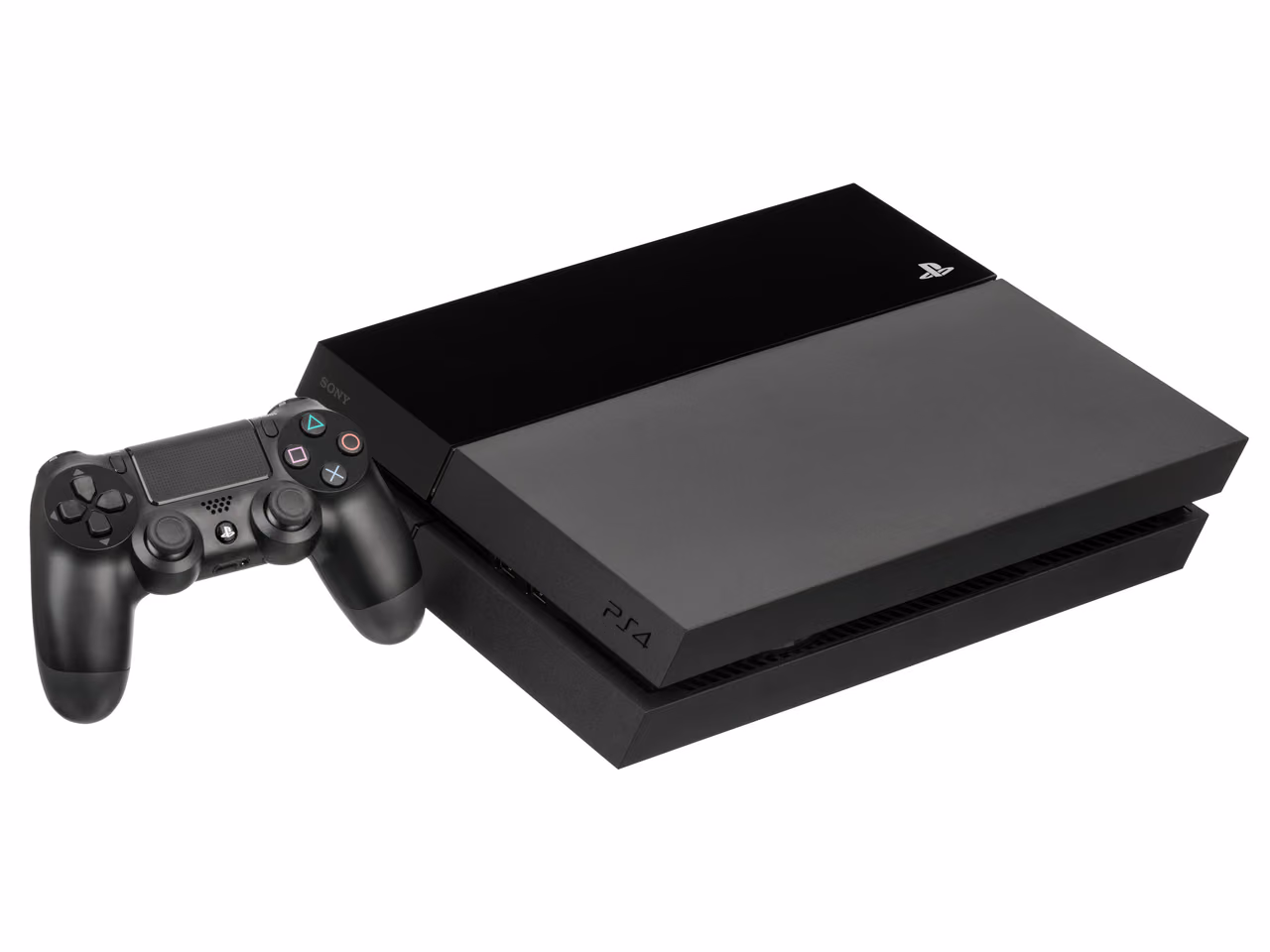 A black Sony PlayStation 4 lying flat and photographed against white, its slanted body split between a gloss half and a matte half, with a controller standing in front of it.